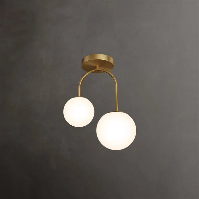 Plafonnier double globe en verre clair avec métal doré scandinave - Lumeria
