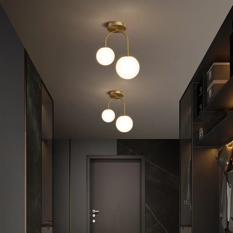 Plafonnier double globe en verre clair avec métal doré scandinave - Lumeria
