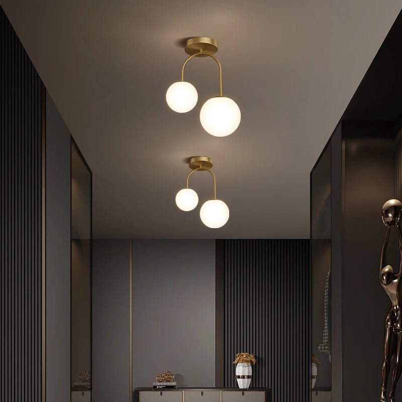 Plafonnier double globe en verre clair avec métal doré scandinave - Lumeria